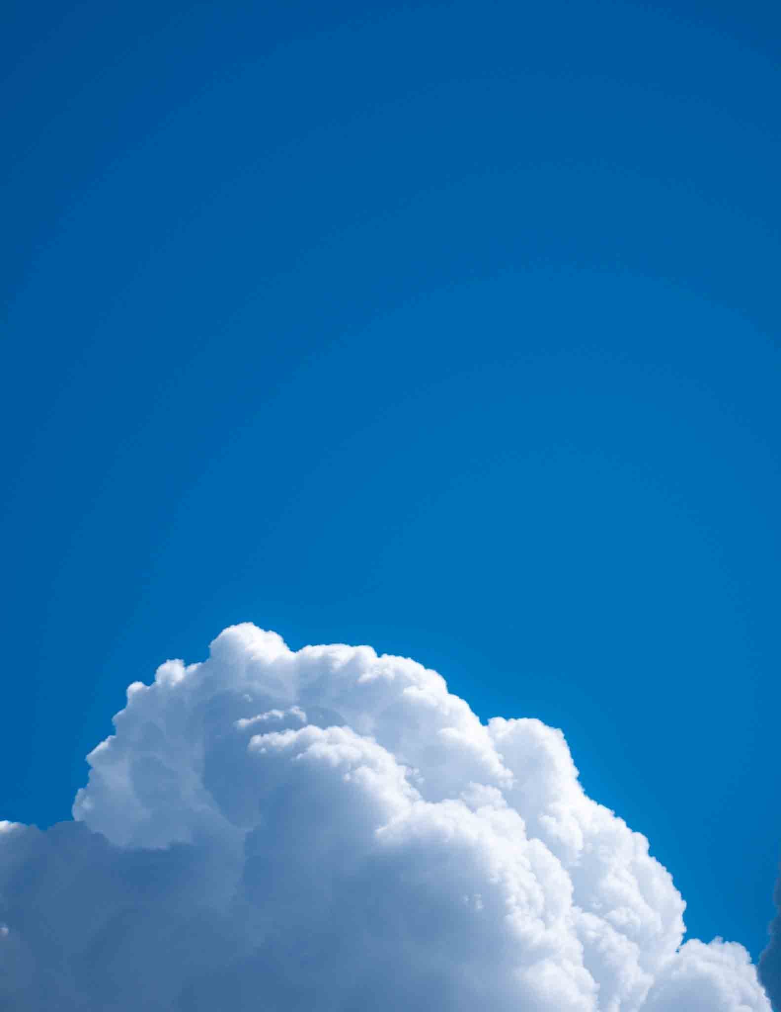 Napping clouds floating on a blue background on 5/8 white single